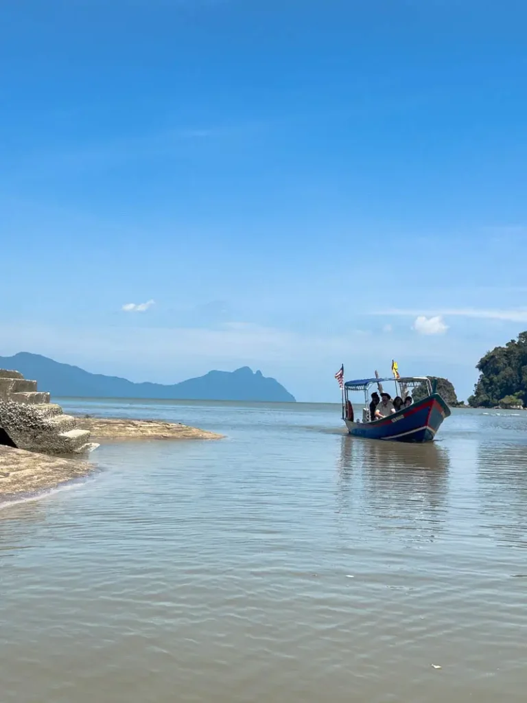 A boat arriving with tourists at Bako National Park