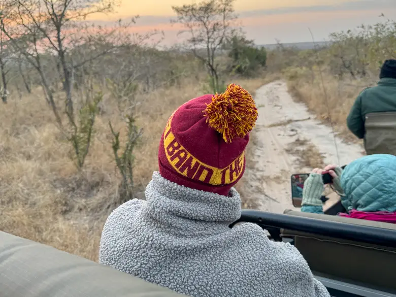 A person wrapped up warm as one of the top tips for South African safaris